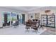 Open living room with stylish seating and view of the pool and patio area at 13295 Eisenhower Dr, Port Charlotte, FL 33953