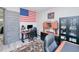 Well-appointed home office featuring a classic American flag, rich wood accents, and comfortable executive seating at 13295 Eisenhower Dr, Port Charlotte, FL 33953