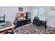 Spacious home office featuring a large desk, executive chairs, ample storage, and a large window at 13295 Eisenhower Dr, Port Charlotte, FL 33953