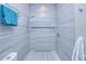 Modern shower with stylish gray tilework, recessed niche, and sleek fixtures for a spa-like experience at 13295 Eisenhower Dr, Port Charlotte, FL 33953