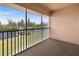 Relaxing screened-in porch overlooking lush green landscaping with waterfront views at 1348 Rock Dove Ct # C201, Punta Gorda, FL 33950