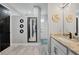 Stylish bathroom boasts a double vanity with granite countertops and walk in shower at 15148 Taurus Cir, Port Charlotte, FL 33981