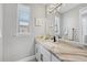 Well-lit bathroom with marble-style countertop, modern black faucet, and stylish vanity at 15148 Taurus Cir, Port Charlotte, FL 33981