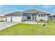 Charming single-Gathering home with manicured lawn and a two-car garage at 15148 Taurus Cir, Port Charlotte, FL 33981