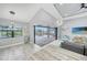 Spacious living room with an open layout and a view of the screened pool area at 15148 Taurus Cir, Port Charlotte, FL 33981