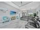 Spacious living room with modern decor, large sectional sofa, and a calming color palette at 15148 Taurus Cir, Port Charlotte, FL 33981