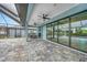 Beautiful screened-in patio with tile flooring and direct access to the outdoor pool at 15148 Taurus Cir, Port Charlotte, FL 33981