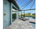 Comfortable lounge seating by the pool with a stunning view of the canal at 15148 Taurus Cir, Port Charlotte, FL 33981