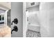 Beautiful bathroom features a modern tiled shower with rainfall shower head and bench at 15148 Taurus Cir, Port Charlotte, FL 33981