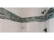 Modern bathroom shower featuring stylish accent tiles and sleek black fixtures at 15890 Viscount Cir, Port Charlotte, FL 33981