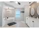 Luxurious bathroom with soaking tub, walk-in shower, and dual vanities with sleek fixtures at 15890 Viscount Cir, Port Charlotte, FL 33981