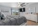 Bright bedroom with a ceiling fan, large windows, and a view of the lanai at 15890 Viscount Cir, Port Charlotte, FL 33981