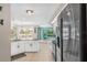 Open kitchen with stainless steel appliances and a clear view into the living area at 15890 Viscount Cir, Port Charlotte, FL 33981