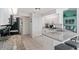 Well-lit kitchen featuring granite countertops, stainless steel appliances, and modern white cabinets at 15890 Viscount Cir, Port Charlotte, FL 33981
