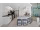 Modern kitchen with white cabinets, granite countertops, stainless steel appliances, and breakfast bar at 15890 Viscount Cir, Port Charlotte, FL 33981