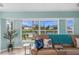 Beautiful living room with a large window offering serene views of the waterfront at 15890 Viscount Cir, Port Charlotte, FL 33981