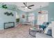 Open-concept living room featuring tile floors, neutral tones, a dining area, and a front door view at 15890 Viscount Cir, Port Charlotte, FL 33981