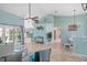 Spacious living area with an open floor plan, tile flooring, and stylish coastal decor at 15890 Viscount Cir, Port Charlotte, FL 33981