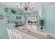 Open-concept living space with dining area, leading to a cozy living room with a ceiling fan at 15890 Viscount Cir, Port Charlotte, FL 33981