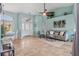 Bright and airy living room features tile floors, a neutral color palette, and ample natural light at 15890 Viscount Cir, Port Charlotte, FL 33981
