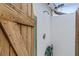 Outdoor shower with wood gate and green hose at 15890 Viscount Cir, Port Charlotte, FL 33981