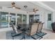 Covered patio with ceiling fans, outdoor seating, and a view of the pool at 15890 Viscount Cir, Port Charlotte, FL 33981