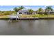 Picturesque waterfront property with private dock, perfect for boating and enjoying scenic water views at 15890 Viscount Cir, Port Charlotte, FL 33981