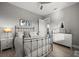 Bedroom with brass bed frame, grey walls, ceiling fan, and wood floors at 1932 Los Alamos Dr, Punta Gorda, FL 33950