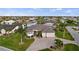 Beautiful home featuring a well-manicured lawn, a circular driveway, and a spacious three-car garage at 1932 Los Alamos Dr, Punta Gorda, FL 33950