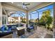 Beautiful outdoor lanai features a seating area and a pool with a screened enclosure at 1932 Los Alamos Dr, Punta Gorda, FL 33950
