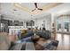 Spacious living area with an open kitchen, large sectional sofa and a tray ceiling at 1932 Los Alamos Dr, Punta Gorda, FL 33950
