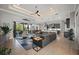 Spacious living room with a tray ceiling, modern decor, and an open floor plan at 1932 Los Alamos Dr, Punta Gorda, FL 33950