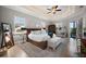 Serene bedroom with tray ceilings, cozy seating, and natural light creating a peaceful sanctuary at 1932 Los Alamos Dr, Punta Gorda, FL 33950