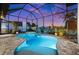 Screened-in pool with a hot tub offers a relaxing outdoor experience at twilight at 1932 Los Alamos Dr, Punta Gorda, FL 33950