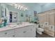 Beautiful bathroom with a vanity, toilet, shower and decorative accents at 2028 Lynx Run, North Port, FL 34288