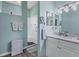 Elegant bathroom with a walk-in shower, vanity with sink, and neutral decor at 2028 Lynx Run, North Port, FL 34288