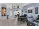 Open dining area showcasing table with chairs, decor, and view of the open floor plan at 2028 Lynx Run, North Port, FL 34288