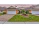 Charming single-story villa boasts an attached garage, manicured landscaping, and a welcoming brick driveway at 2028 Lynx Run, North Port, FL 34288