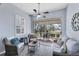 Relaxing lanai with comfortable wicker furniture and a view of the outdoors at 2028 Lynx Run, North Port, FL 34288