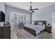 Cozy primary bedroom with a comfortable bed, bay window, and peaceful decor at 2028 Lynx Run, North Port, FL 34288