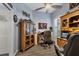 Inviting home office features wood cabinets, a ceiling fan and plenty of light at 2028 Lynx Run, North Port, FL 34288