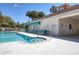 Community pool offers a clean and inviting space for relaxation and recreation with plenty of seating at 2028 Lynx Run, North Port, FL 34288