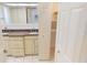 Bathroom featuring double sinks, granite countertops, and closet storage at 2028 River Basin Ter, Punta Gorda, FL 33982