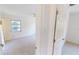 Bright carpeted bedroom featuring a window and a ceiling fan at 2028 River Basin Ter, Punta Gorda, FL 33982