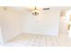 Bright dining room featuring tile floors and an elegant chandelier at 2028 River Basin Ter, Punta Gorda, FL 33982