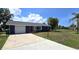 Charming home with a well-manicured lawn and a spacious driveway and attached garage at 2028 River Basin Ter, Punta Gorda, FL 33982