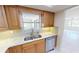 Updated kitchen featuring granite counters, stainless steel appliances, and plenty of natural light at 2028 River Basin Ter, Punta Gorda, FL 33982