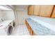 Laundry room featuring white tile floors, washer and dryer and cabinets with granite countertops at 2028 River Basin Ter, Punta Gorda, FL 33982