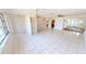 Spacious living area with tile flooring, open layout, and views into the kitchen and other rooms at 2028 River Basin Ter, Punta Gorda, FL 33982