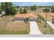Expansive aerial view of home, showcasing the property, neighborhood, and nearby trees at 2365 Nuremberg Blvd, Punta Gorda, FL 33983